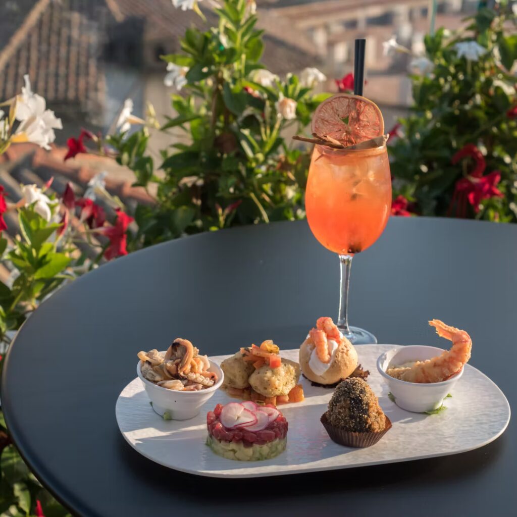 cocktail and fish with view - sky rooftop bar & restaurant taormina